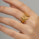 Anillo estrella y concha de mar oro