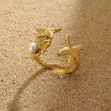 Anillo estrellas de mar perla oro