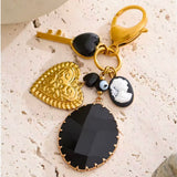 Charm bolso negro oro