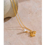 Collar mini estrella cangrejo perla oro