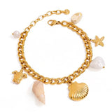 Pulsera gruesa charms marinos oro