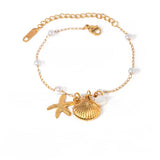 Pulsera estrella de mar y concha perla oro