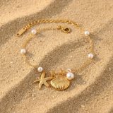 Pulsera estrella de mar y concha perla oro
