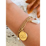 Pulsera charms flores y perla oro