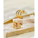 Pendiente triple oro