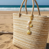 Charm bolso conchas naturales oro