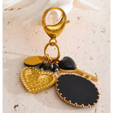 Charm bolso negro oro