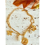 Pulsera charms flores y perla oro