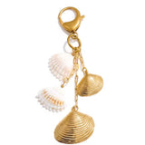 Charm bolso conchas naturales oro