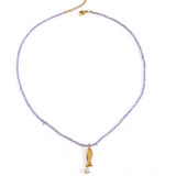 Collar cuentas lila pez oro