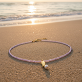 Collar cuentas lila pez oro