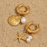Pendiente estrella de mar y concha perla oro