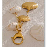 Charm Conchas oro