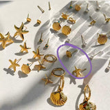 Pendientes estrella concha oro