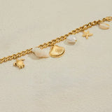 Pulsera gruesa charms marinos oro
